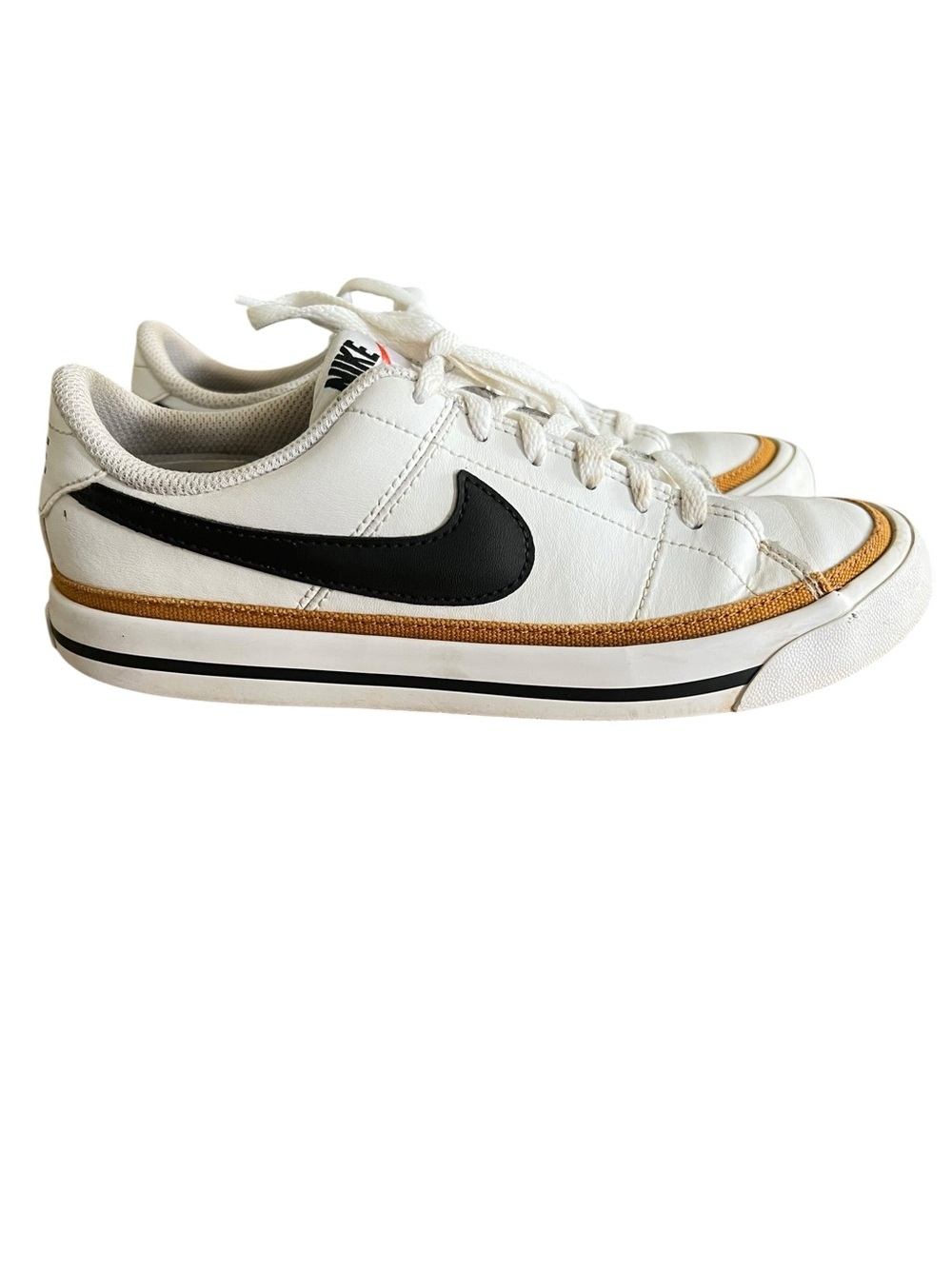 Nike Court Legacy Next Nature shoes in a white black swoosh and desert trim.